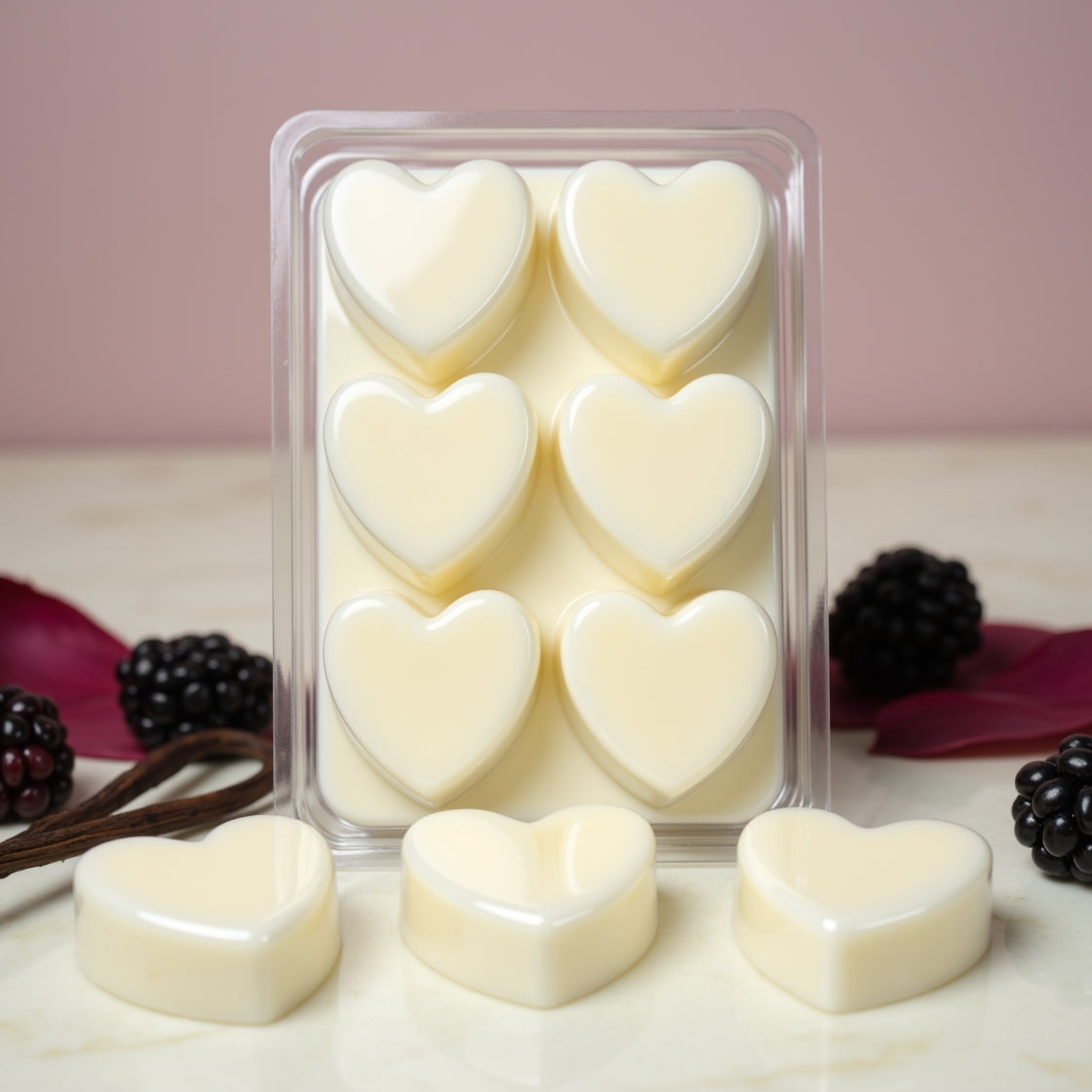 A pack of dark purple, heart-shaped Black Raspberry & Vanilla soy wax melts.