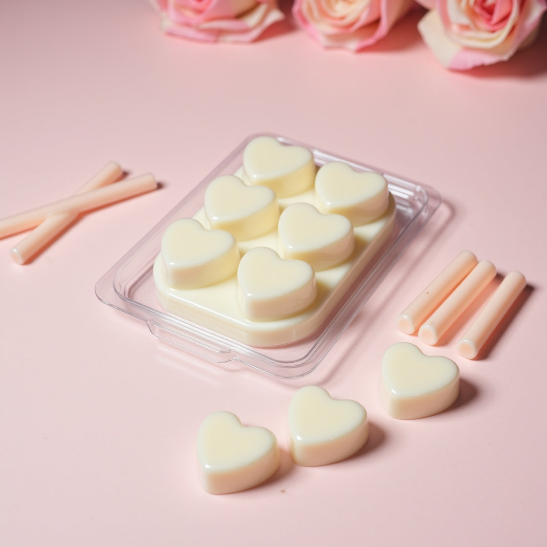 A pack of pink, heart-shaped Musk Stick soy wax melts.