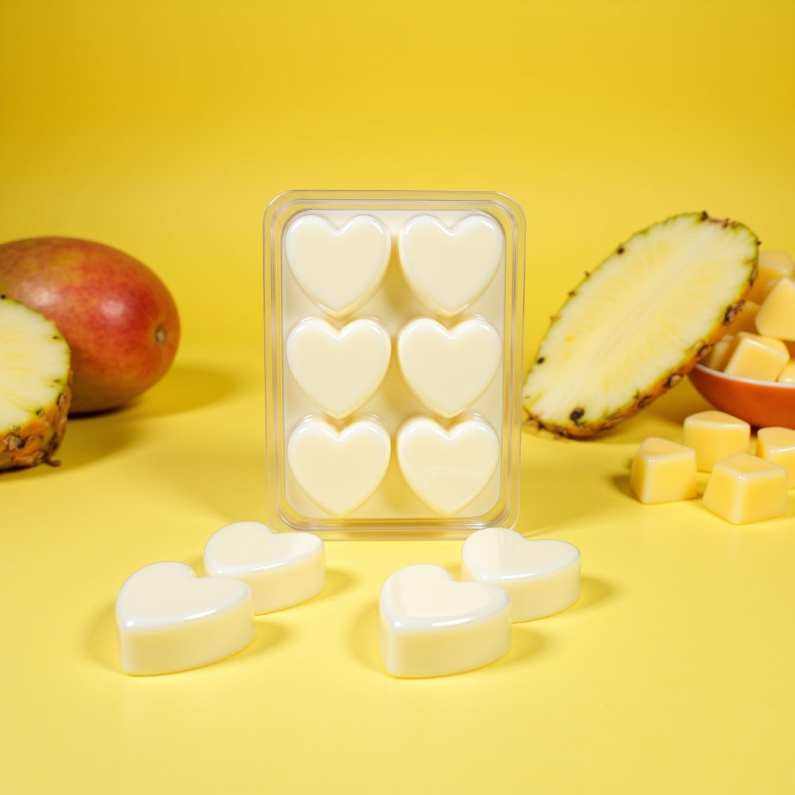 A pack of tropical Pineapple Mango scented soy wax melts in a clamshell.
