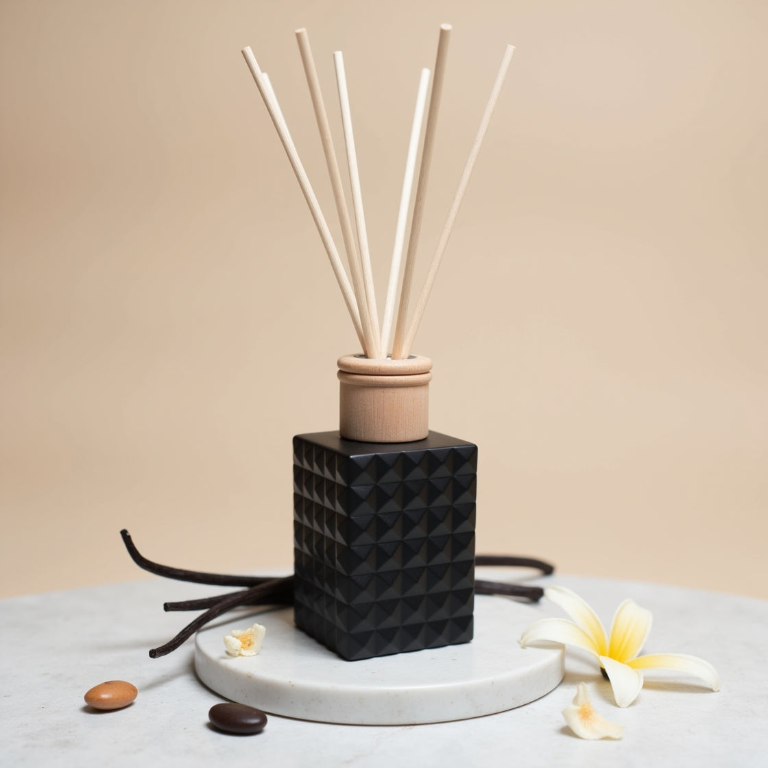 A classic Very Vanilla scented reed diffuser in a matte black bottle.